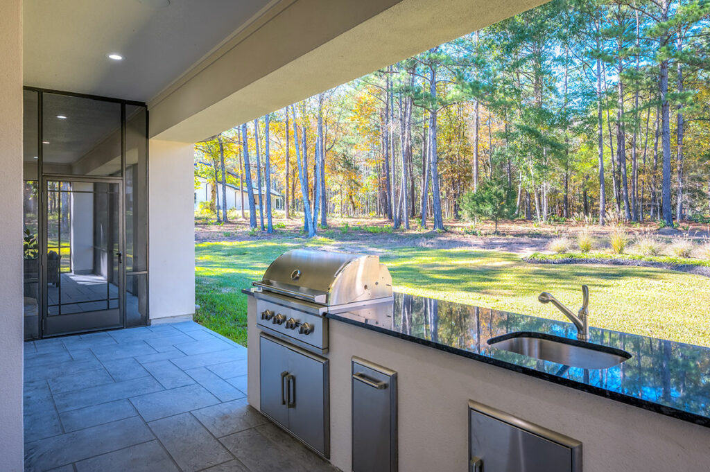 All-season Room With Fireplace And Panoramic Windows Overlooking Backyard