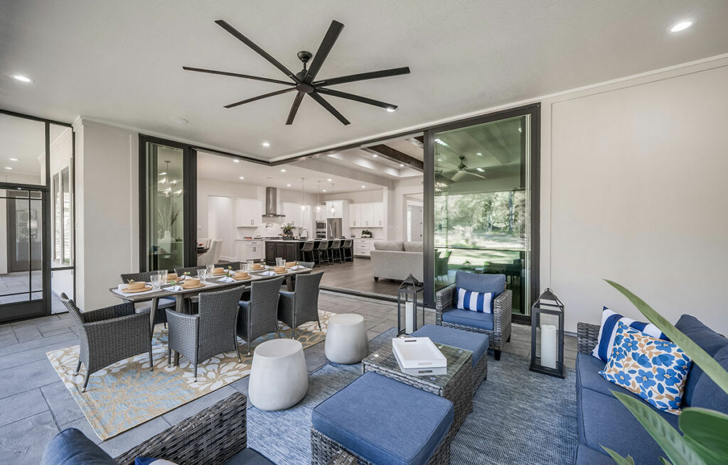 Four-season Sunroom With Retractable Glass Doors And Ceiling Fan