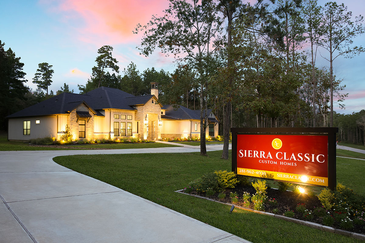 Grand Ranch Model Home custom build in Houston Quality custom home builder home with front yard lighting